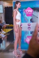 Модель в купальнике на выставке CPM 2018