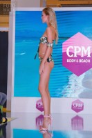 Девушка в купальнике на выставке CPM 2018